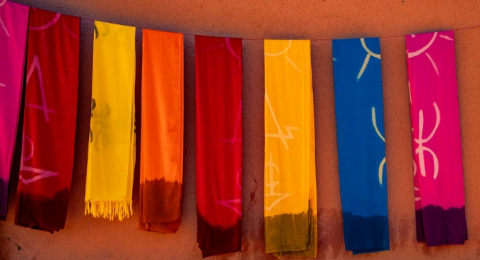 Colorful fabrics hanging on a line with patterns